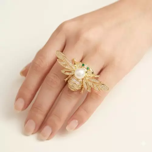 Anillo avispa con circones y ojos verdes rodio dorado