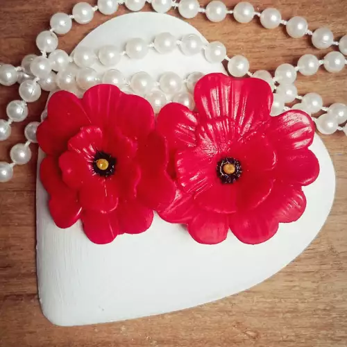 Aretes flor coral hechos a mano en arcilla