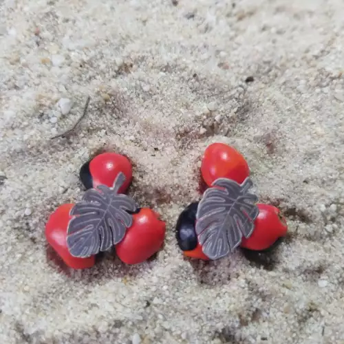 Aretes hojas de palma diseño elegante para mujer