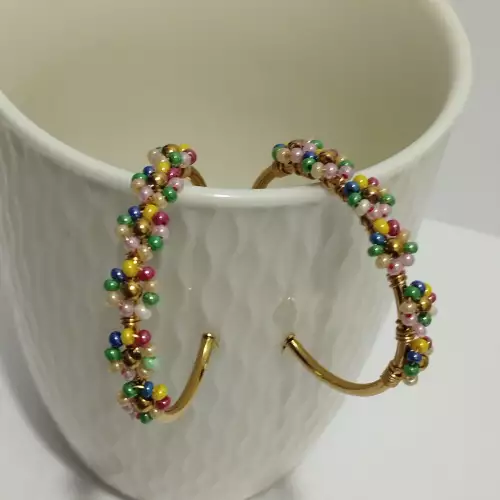 Candonga entorchada flores tonos pastel perlado acero