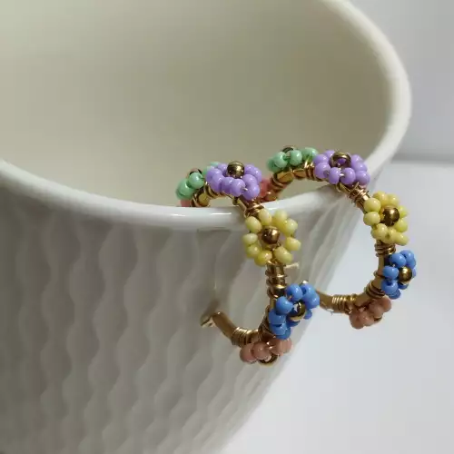 Candonga flores tonos pastel acero dorado grande
