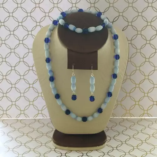 Collar, aretes y pulsera ojo de gato azul cielo