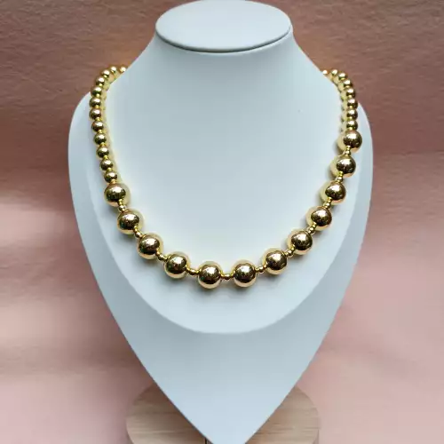 Collar balines esferas doradas graduadas en rodio