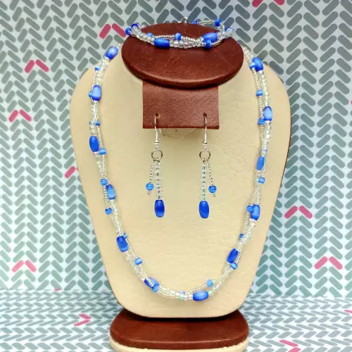 Collar doble capa aretes pulsera ojo de gato azul