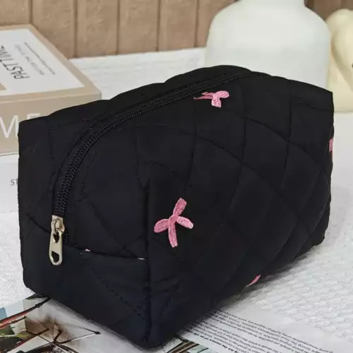 Cosmetiquera acolchada con lazos bordados rosas