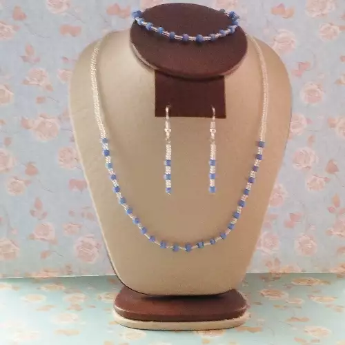 J307. DELICADO JUEGO DE COLLAR, ARETES Y PULSERA EN OJO DE GATO AZUL