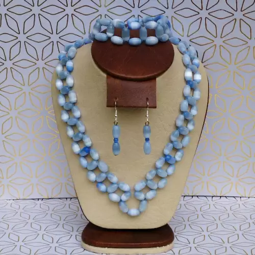 Juego collar, aretes y pulsera ojo de gato azul cielo