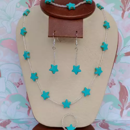 Juego de collar, aretes, pulsera y anillo estrella turquesa