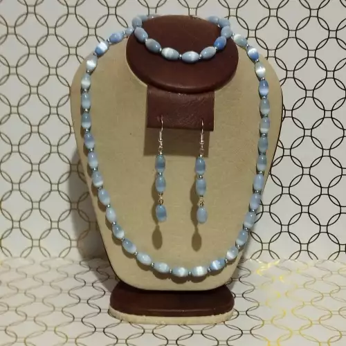Juego de collar, aretes y pulsera ojo de gato azul cielo