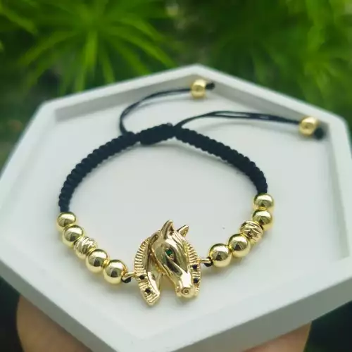 Manilla tejida con dije caballo rodio dorado