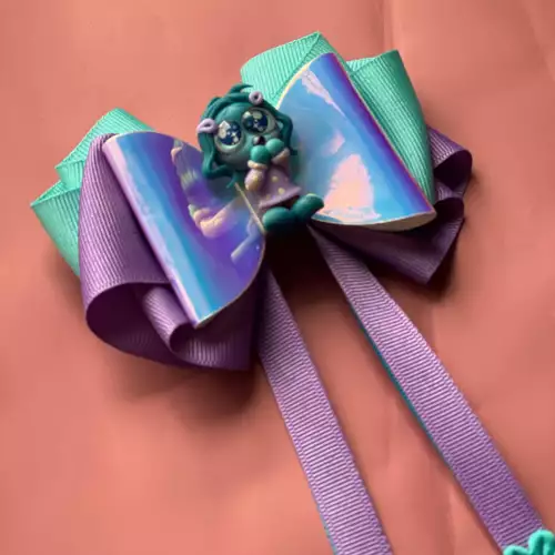 Moño Envidia con diseño brillante para niña