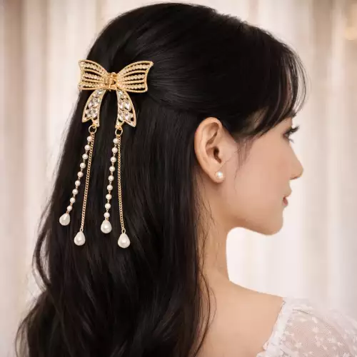 Pinza caimán moño dorado con pedrería para cabello