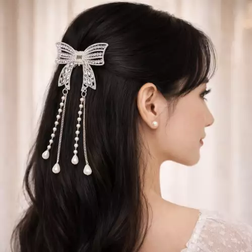 Pinza caimán moño plateado con pedrería para cabello