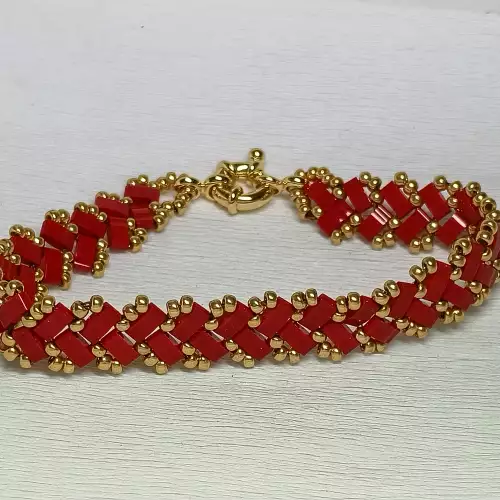 Pulsera tejida artesanal lazo amor rojo y oro